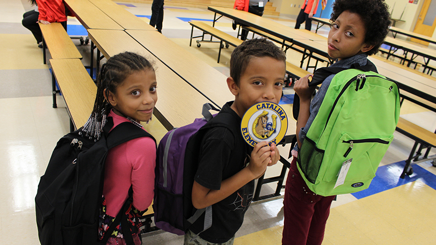 Children posing with new supplies