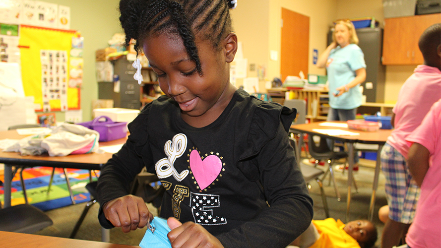 Student opening gifts