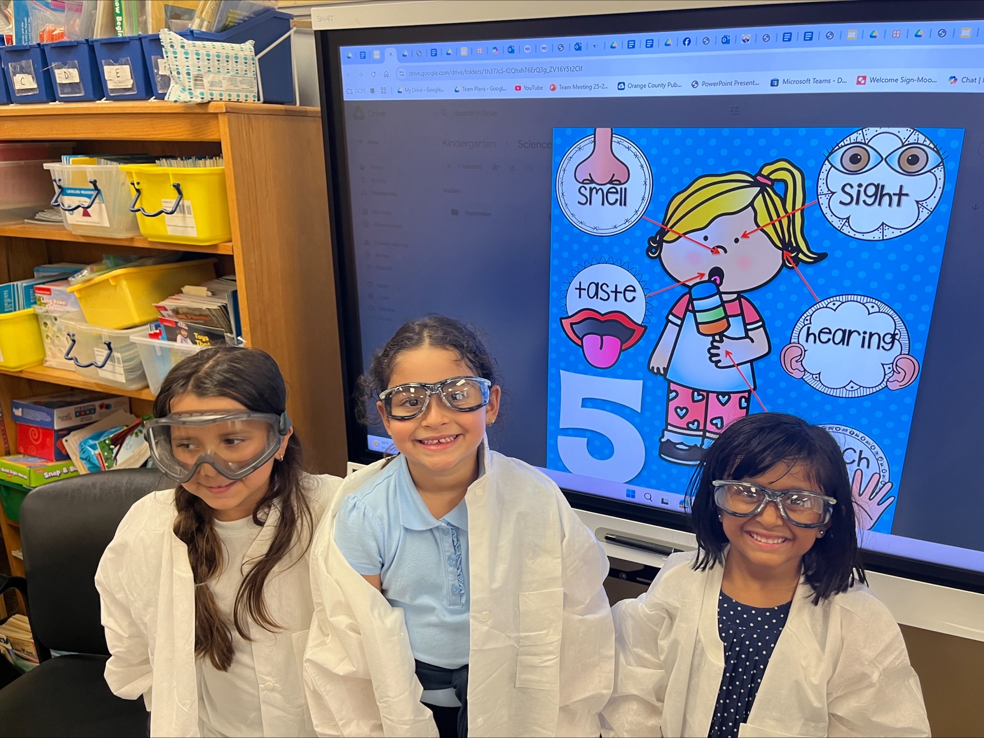 Students with STEM supplies